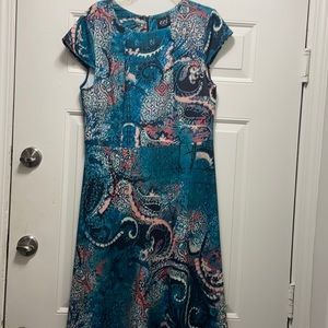 Medium length dress with zip up back; size large